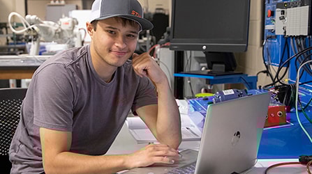 Student at computer in manufacturing lab